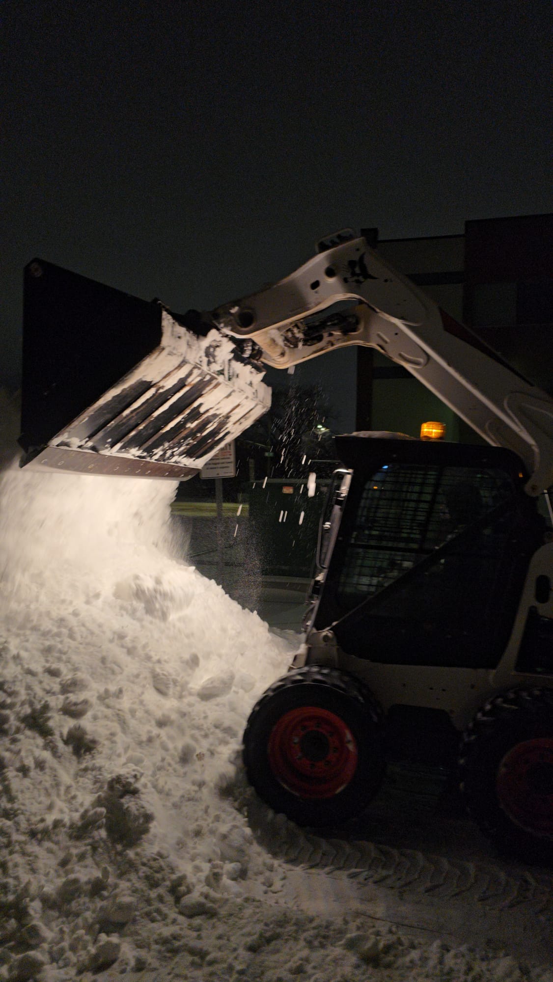 Snow piled at the edge of a commercial lot in Edmonton