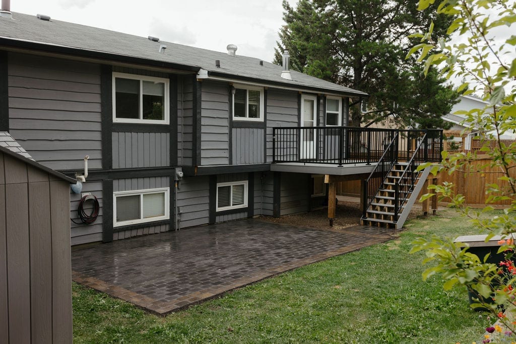 Backyard with new deck, paver patio and lawn