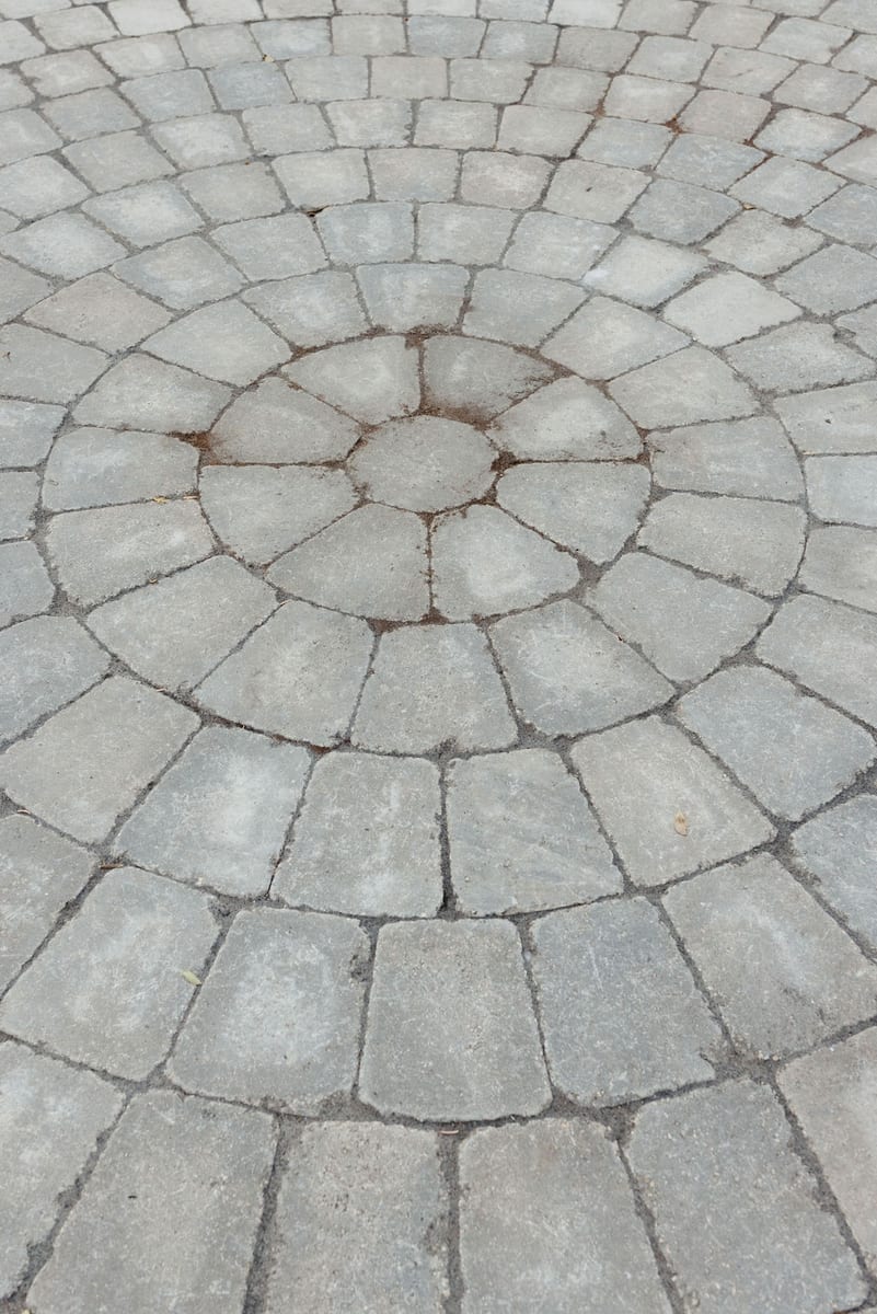 Circular paver pattern on a finished patio