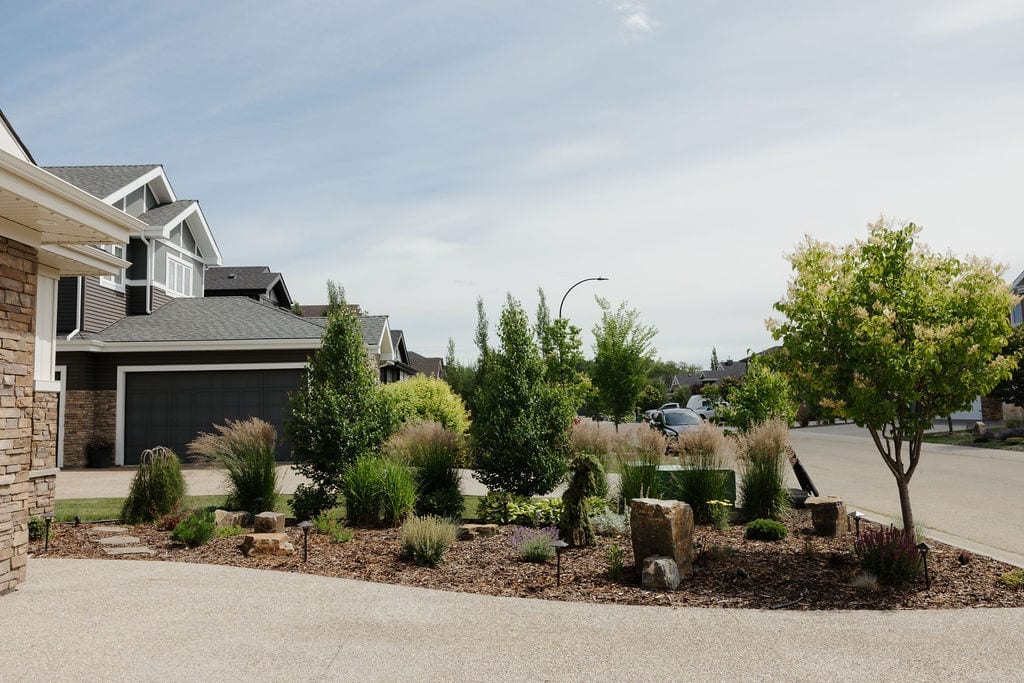 Front yard rock and shrub beds